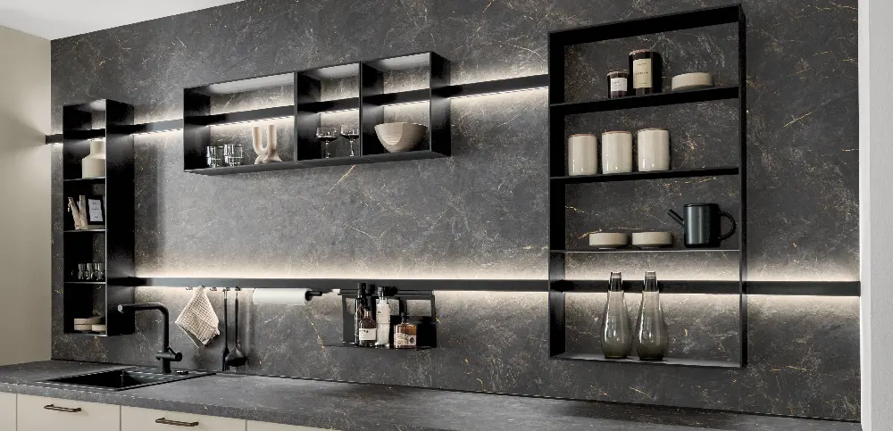 Kitchenwall with artworks standing on shelves fitted with light Kitchenwall with artworks standing on shelves fitted with light