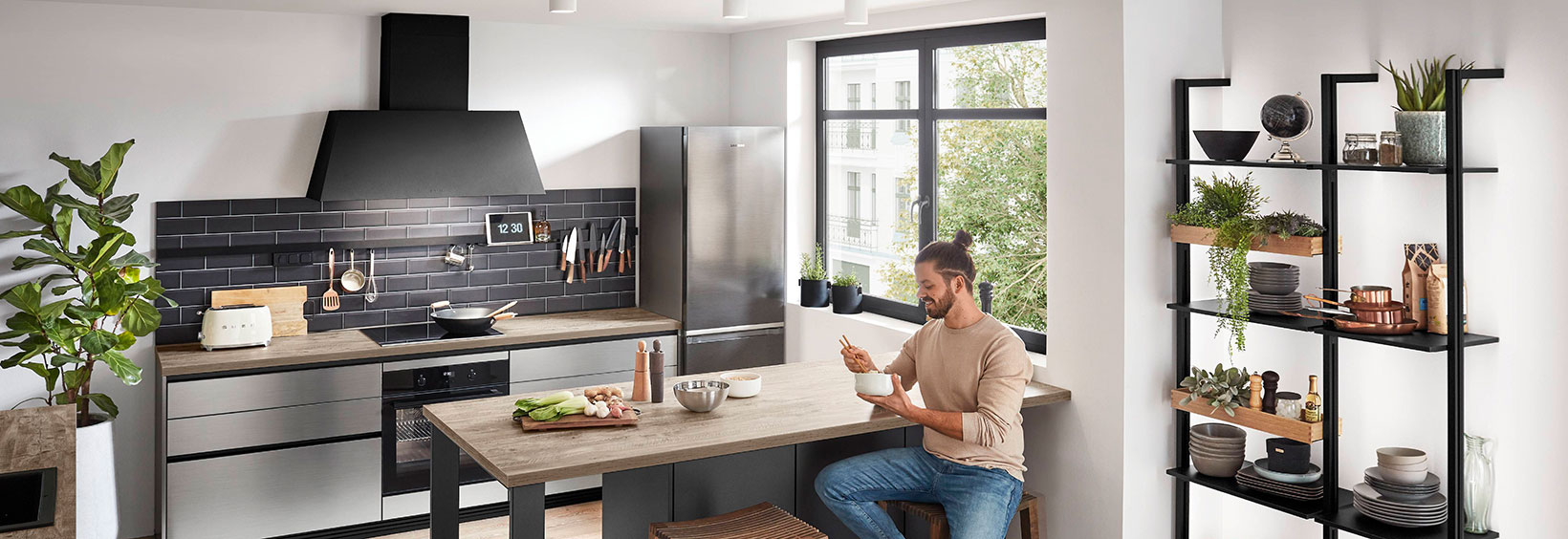 Young men eating in a modern kitchen Young men eating in a modern kitchen